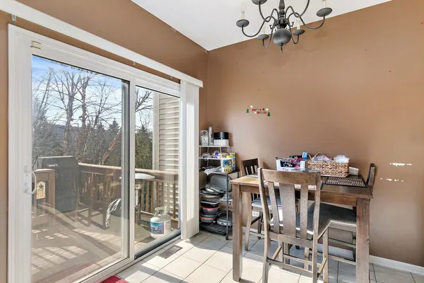 a dining room with furniture window and outside view