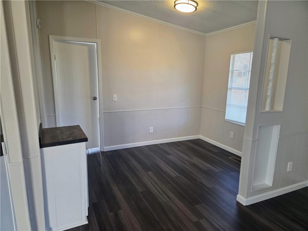 190 B Sweetwater Branch Road Fort Mitchell, AL 36856 - Photo 9 of 18 Dining room featuring a decorative wall and dark wood finished floors