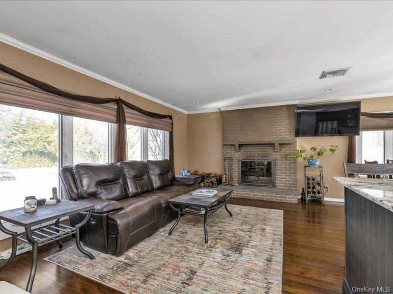 1360 Wilson Road East Meadow, NY 11554 - Photo 3 of 19 Living Room with wood burning FP