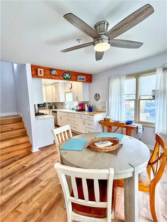 a kitchen with a table chairs and a dining table