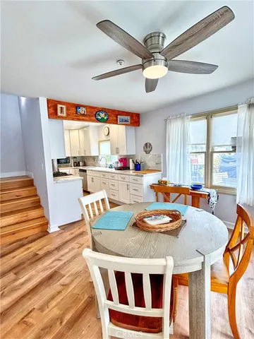 a kitchen with a table chairs and a dining table