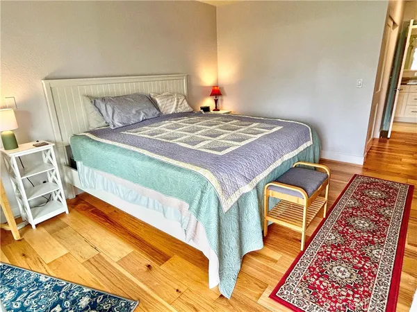 a bedroom with a bed and walk in closet