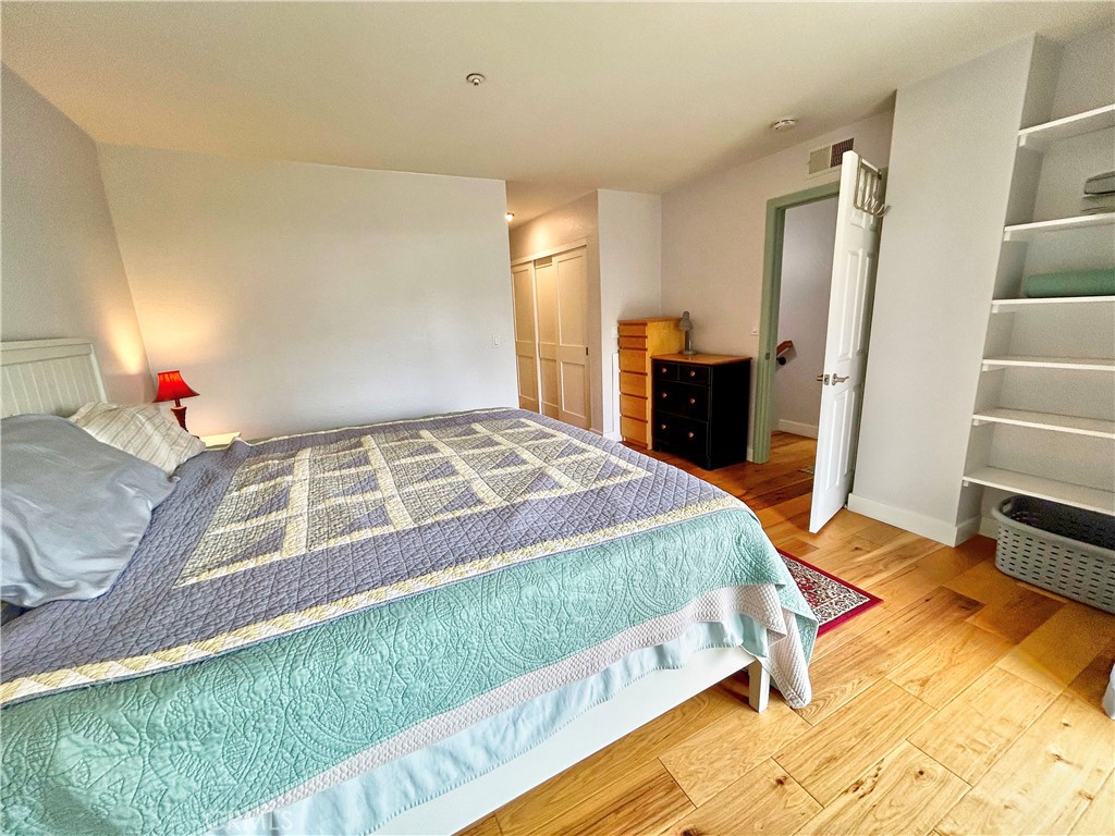 258 West Escalones, Unit 6R San Clemente, CA 92672 - Photo 28 of 37 a bedroom with a bed and walk in closet