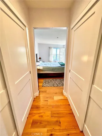 a bathroom with a granite countertop toilet sink and mirror