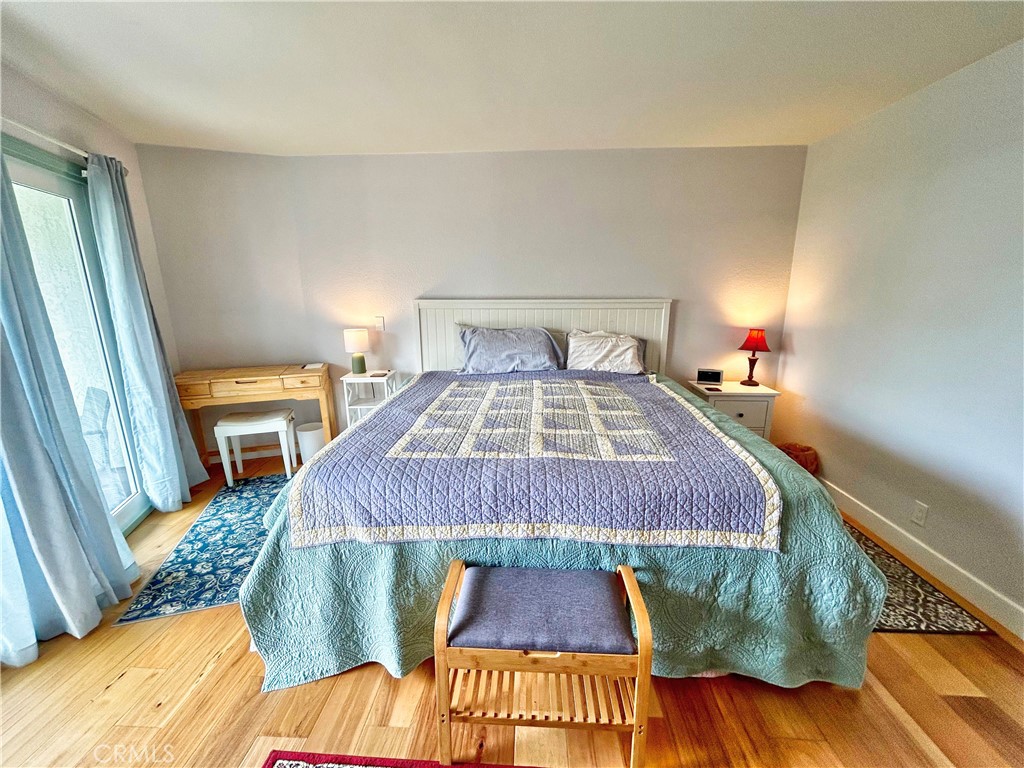 258 West Escalones, Unit 6R San Clemente, CA 92672 - Photo 35 of 37 a bedroom with a bed and a mirror