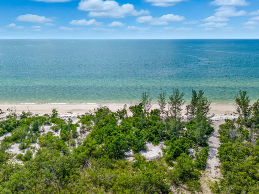 0 Keewaydin Naples, FL 34113 - Photo 10 of 18 a view of a lake with a yard