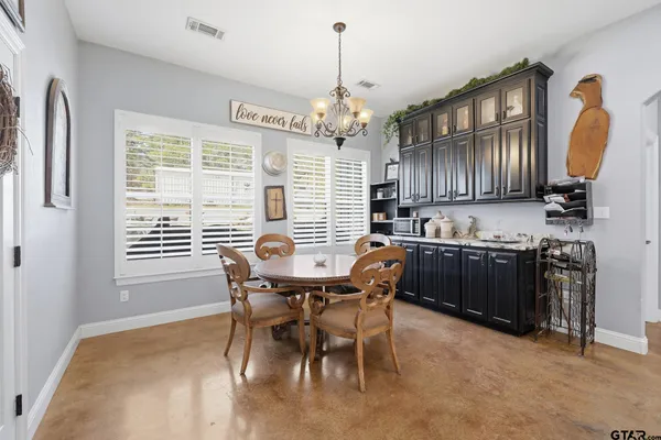 a bedroom with furniture and a bed