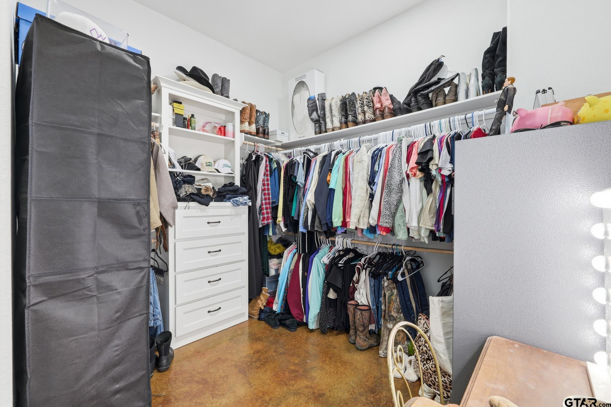 847 Calloway Road Marshall, TX 75670 - Photo 14 of 33 a view of walk in closet with clothes and shoes