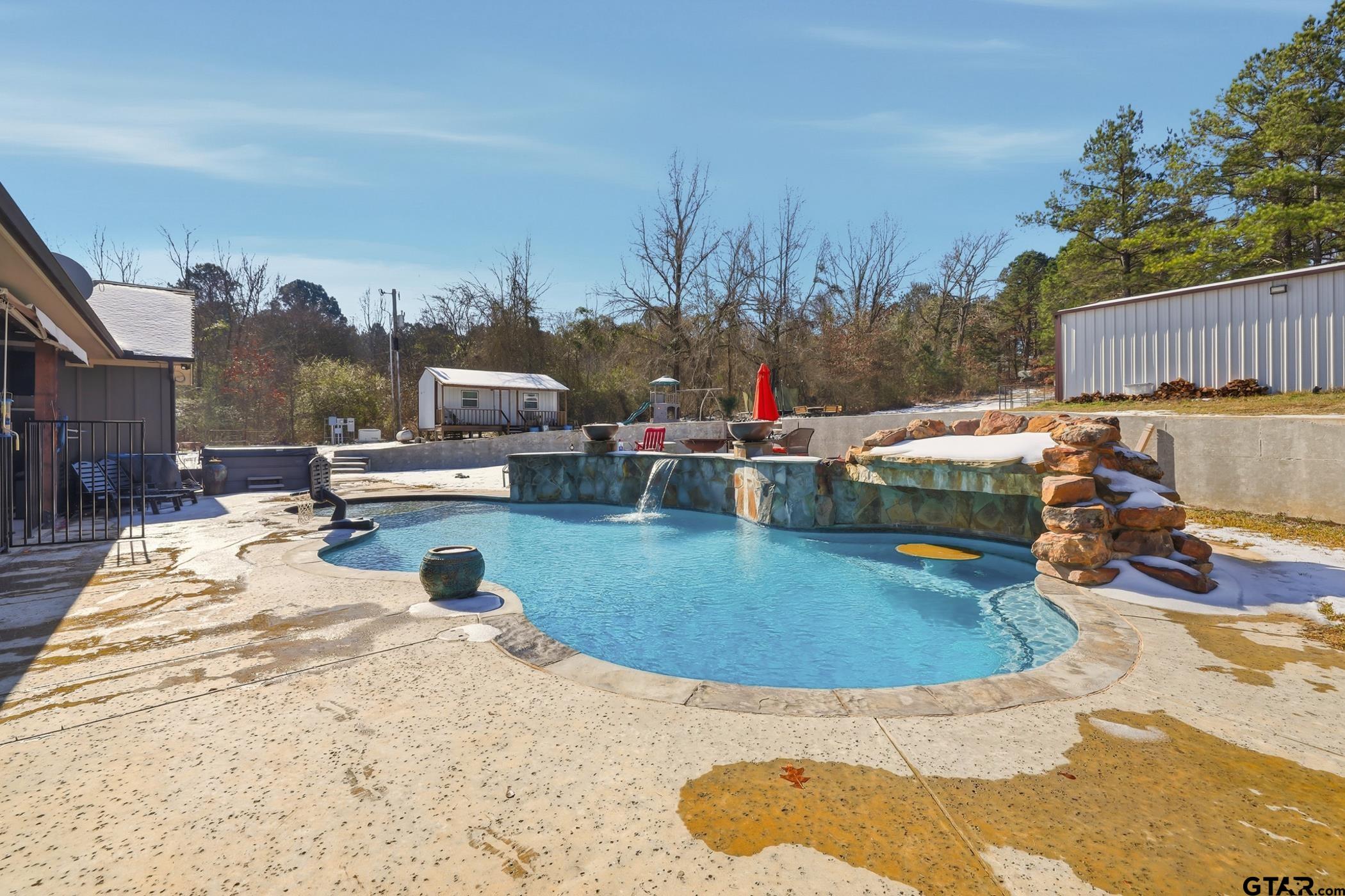 847 Calloway Road Marshall, TX 75670 - Photo 23 of 33 a view of a swimming pool with a patio