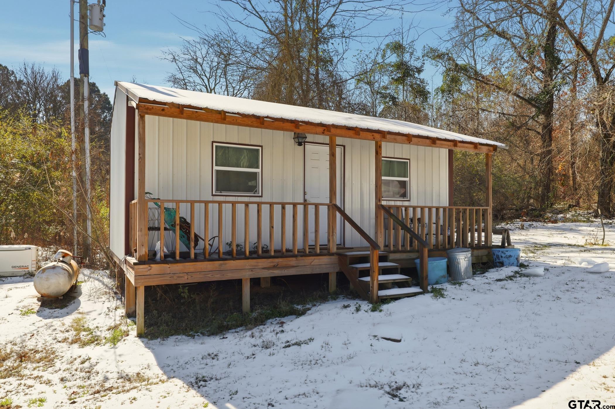 847 Calloway Road Marshall, TX 75670 - Photo 25 of 33 a view of a chair and table in the backyard