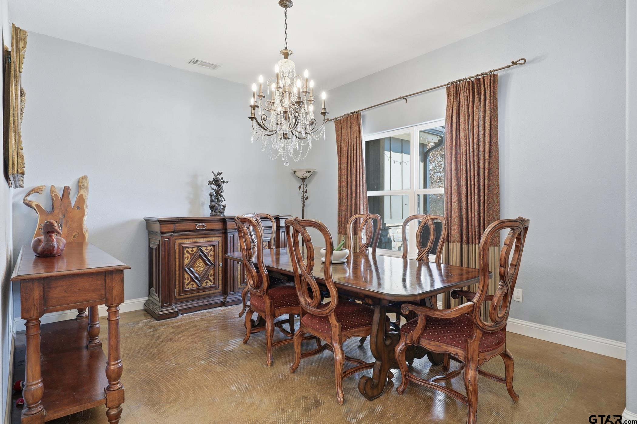 847 Calloway Road Marshall, TX 75670 - Photo 6 of 33 a view of a dining room with furniture and chandelier