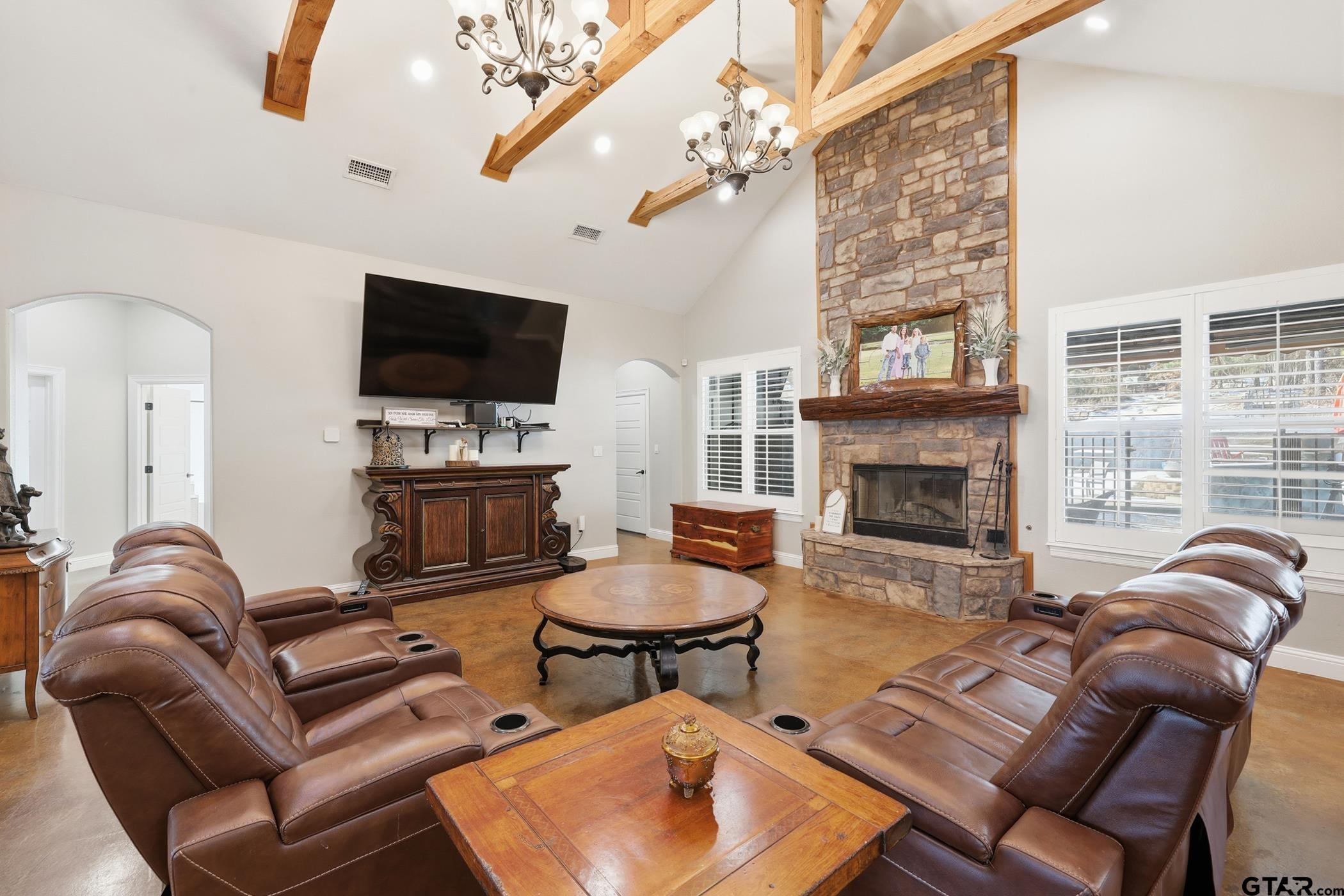 847 Calloway Road Marshall, TX 75670 - Photo 7 of 33 a living room with furniture a flat screen tv and a fireplace
