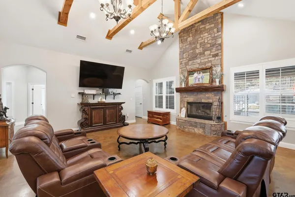 a spacious bathroom with a double vanity sink a mirror and a shower