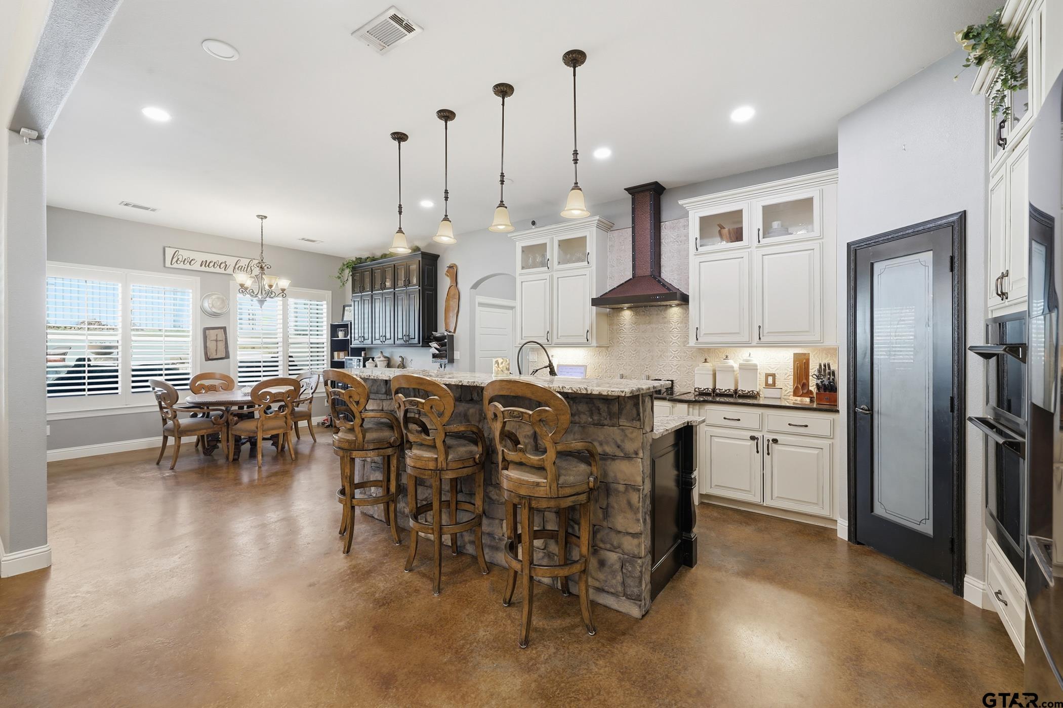 847 Calloway Road Marshall, TX 75670 - Photo 9 of 33 a large kitchen with a table and chairs