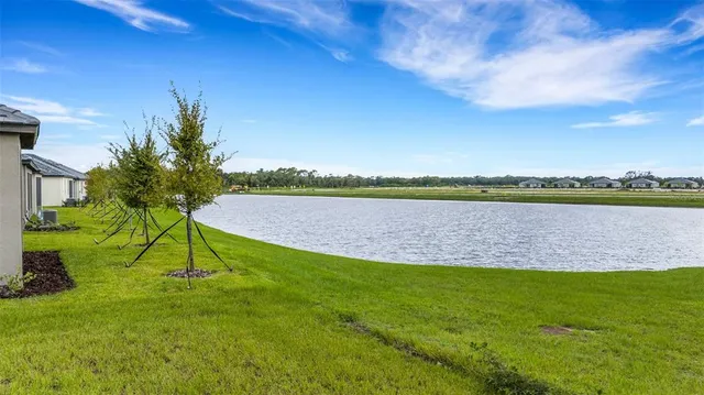 a kitchen with stainless steel appliances a refrigerator sink and microwave