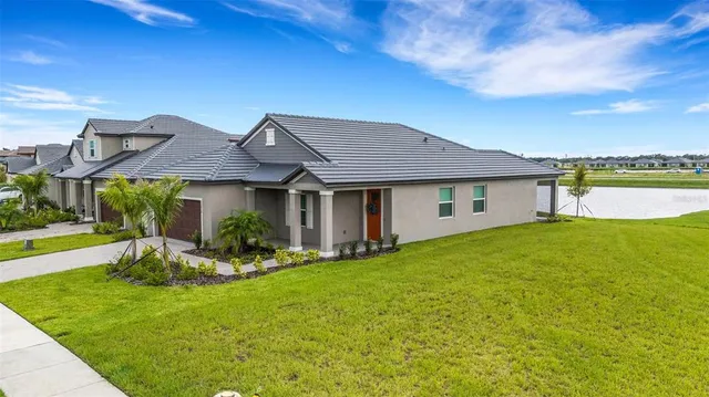 a kitchen that has a sink and a stove in it