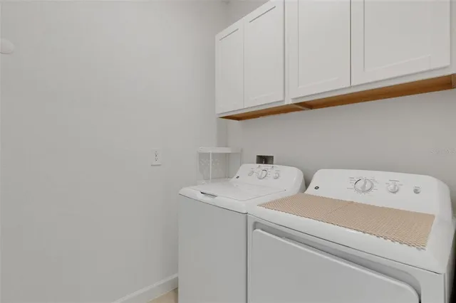 a bathroom with double sink and a mirror