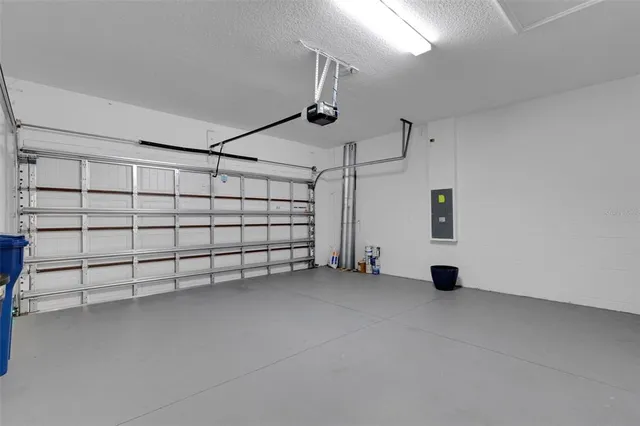 a yellow plant sitting in front of a house