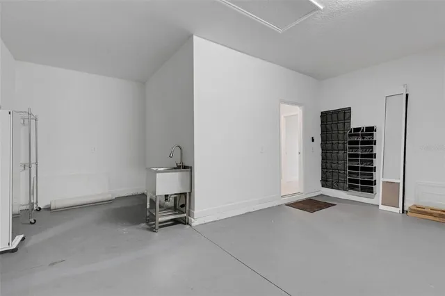 a view of backyard with potted plants