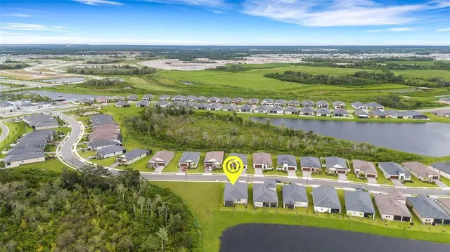a view of a city with an ocean houses lake and ocean view