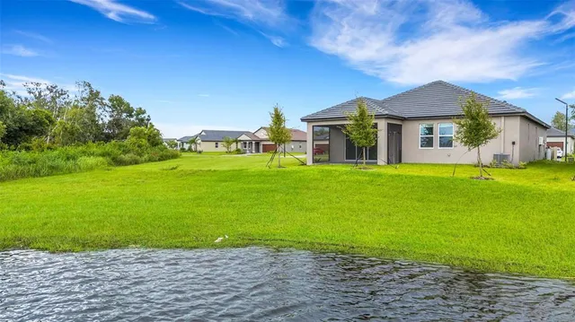 a view of a lake with a big yard