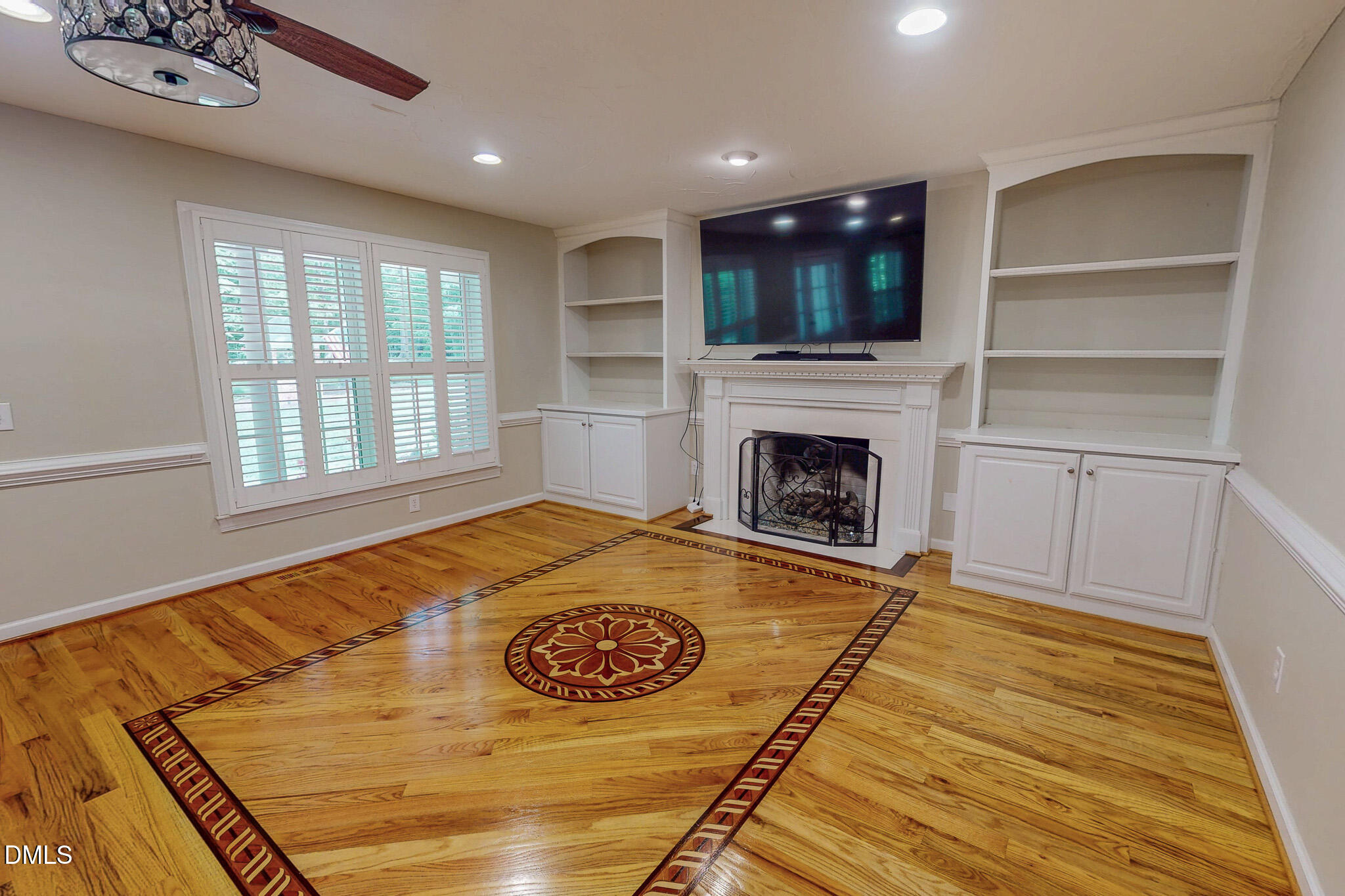 2428 Helena Moriah Road Timberlake, NC 27583 - Photo 12 of 73 a view of a livingroom with a fireplace wooden floor and window