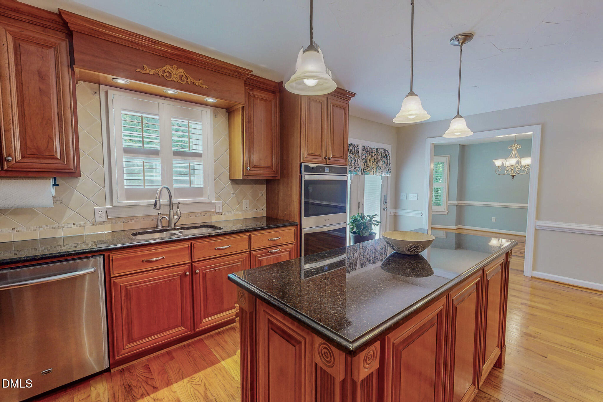 2428 Helena Moriah Road Timberlake, NC 27583 - Photo 13 of 73 a kitchen with stainless steel appliances granite countertop a sink a window and chairs