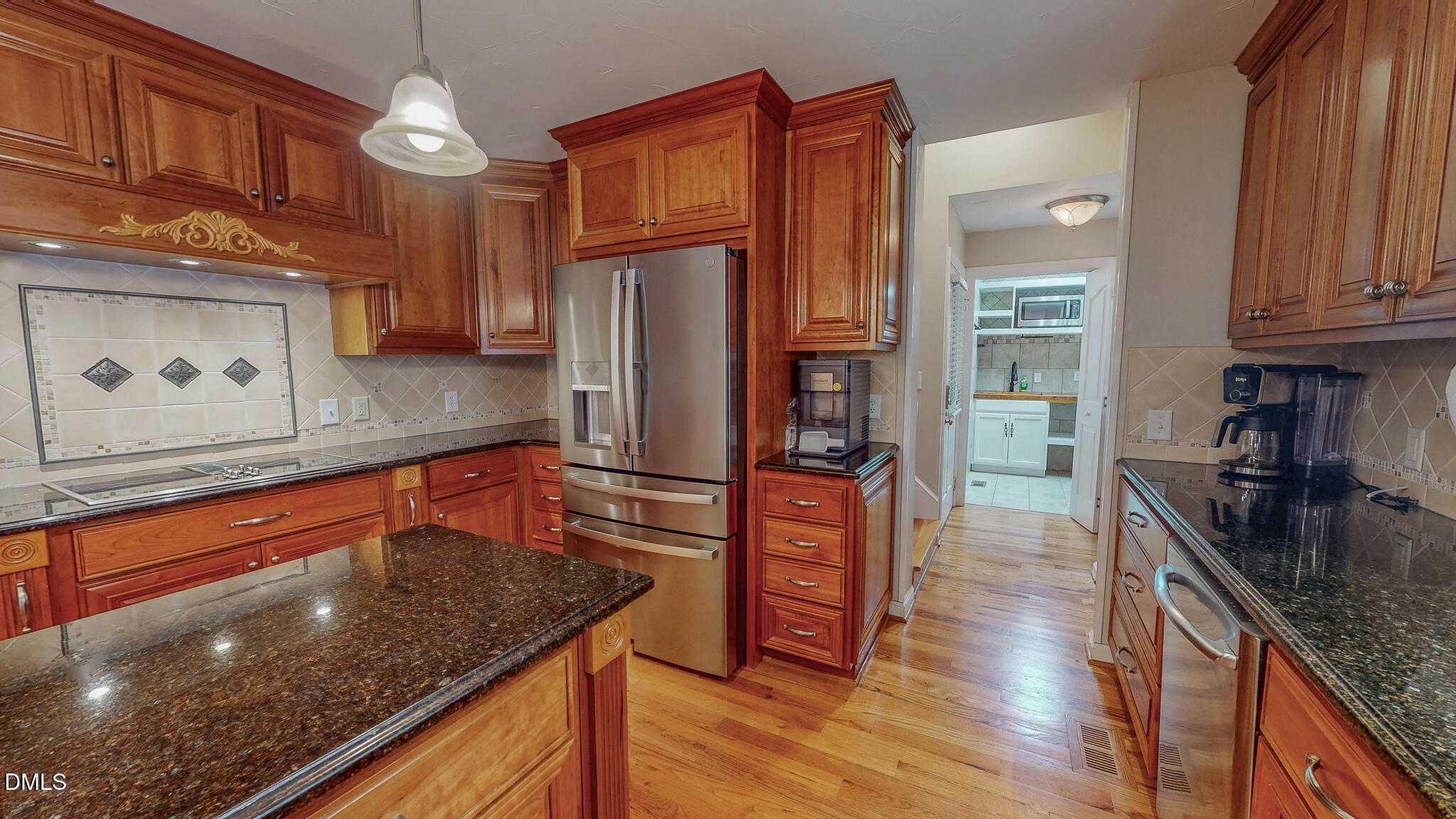 2428 Helena Moriah Road Timberlake, NC 27583 - Photo 14 of 73 a kitchen with stainless steel appliances granite countertop a sink a stove and a wooden floors