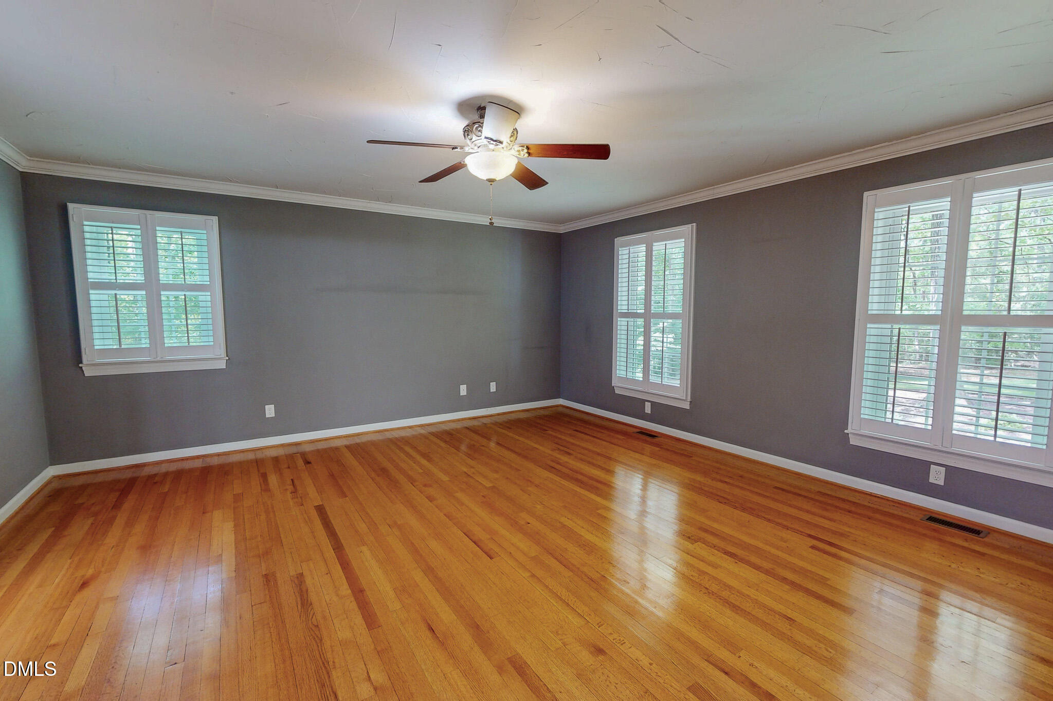 2428 Helena Moriah Road Timberlake, NC 27583 - Photo 16 of 73 a view of empty room with wooden floor and fan