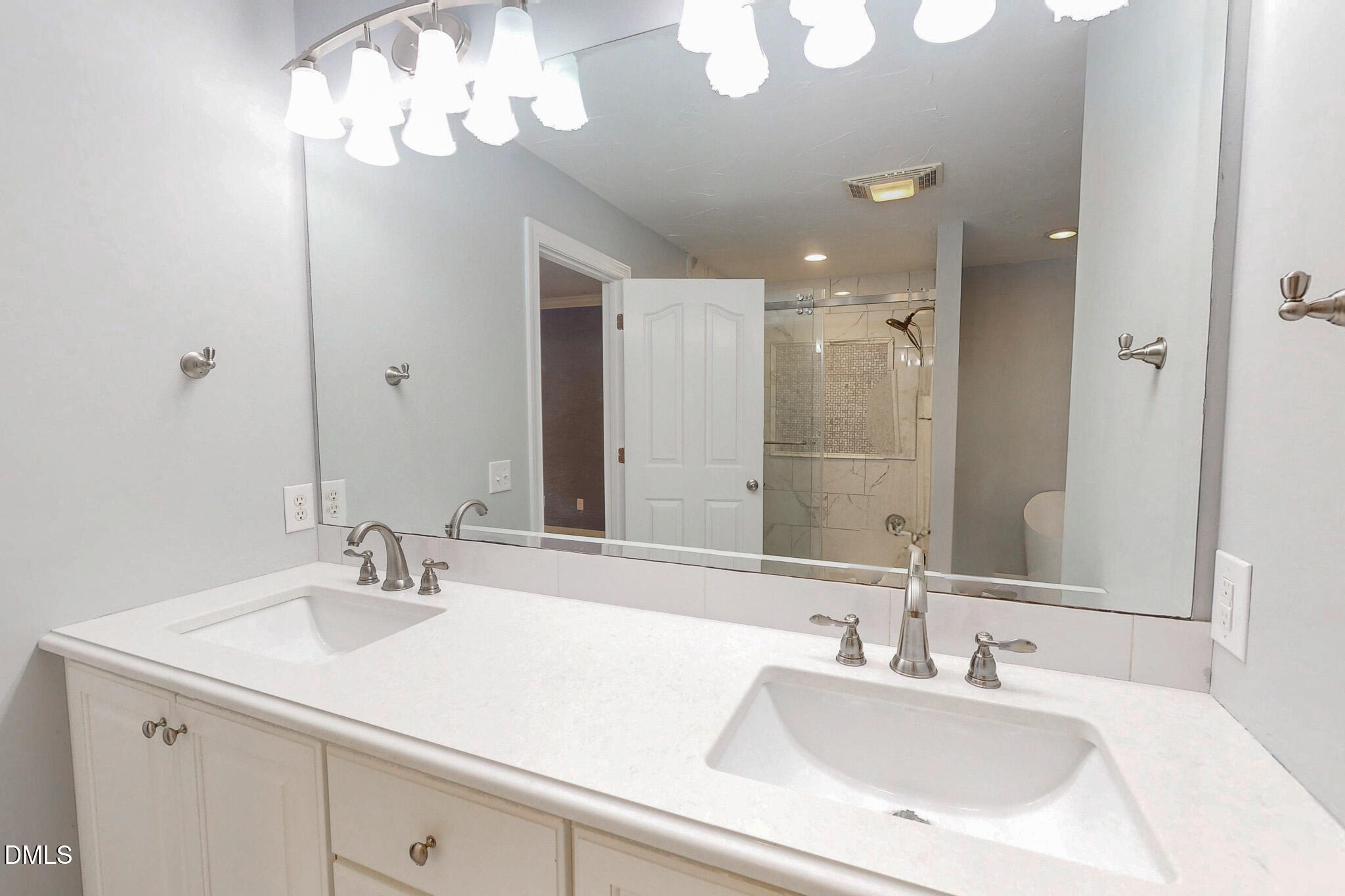 2428 Helena Moriah Road Timberlake, NC 27583 - Photo 21 of 73 a bathroom with a sink double vanity and a mirror