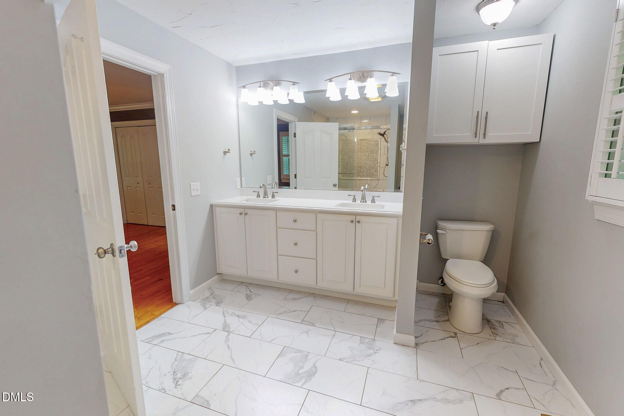 2428 Helena Moriah Road Timberlake, NC 27583 - Photo 22 of 73 a spacious bathroom with a toilet sink and mirror