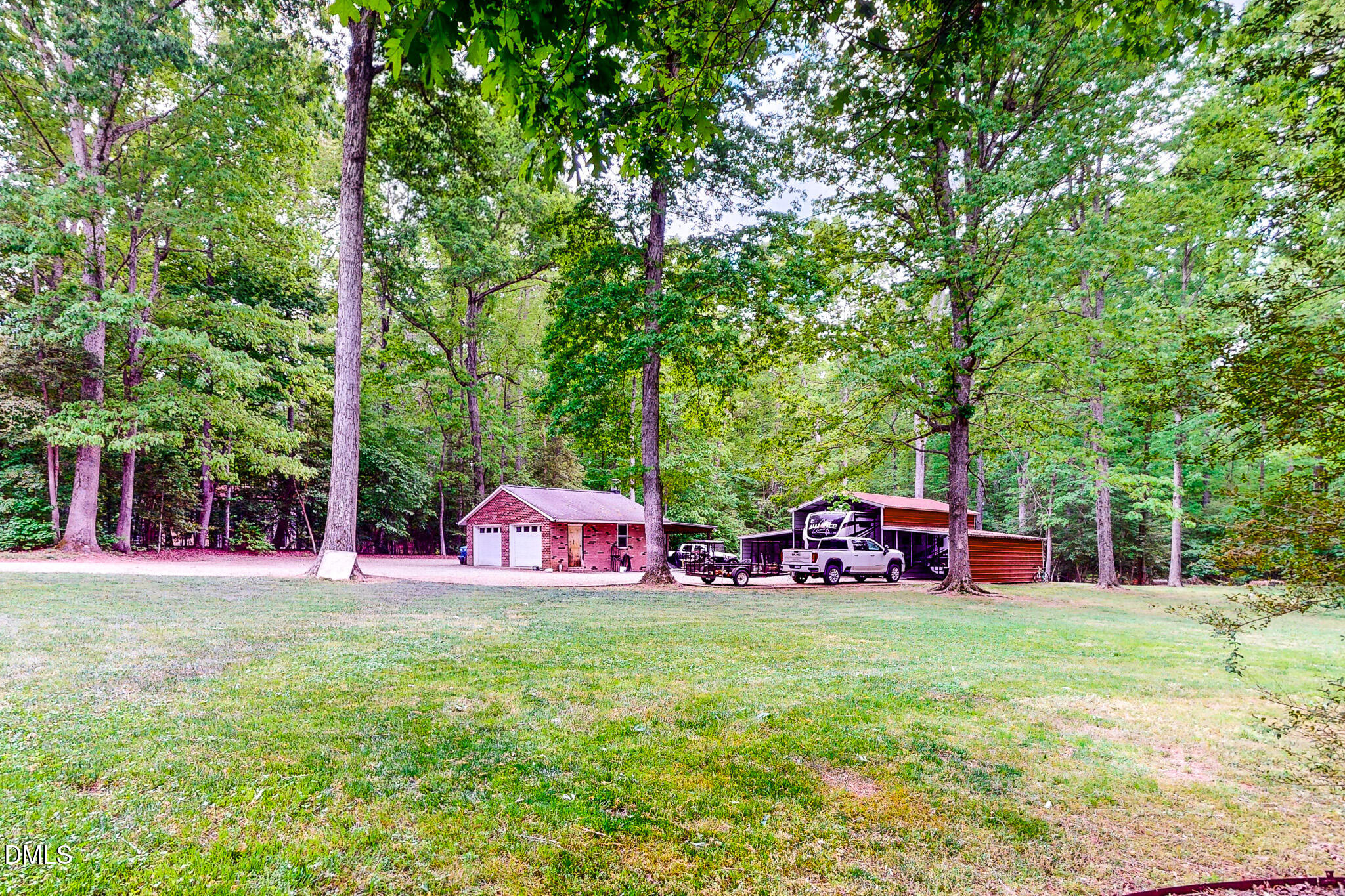 2428 Helena Moriah Road Timberlake, NC 27583 - Photo 31 of 73 a view of a house with backyard and sitting area