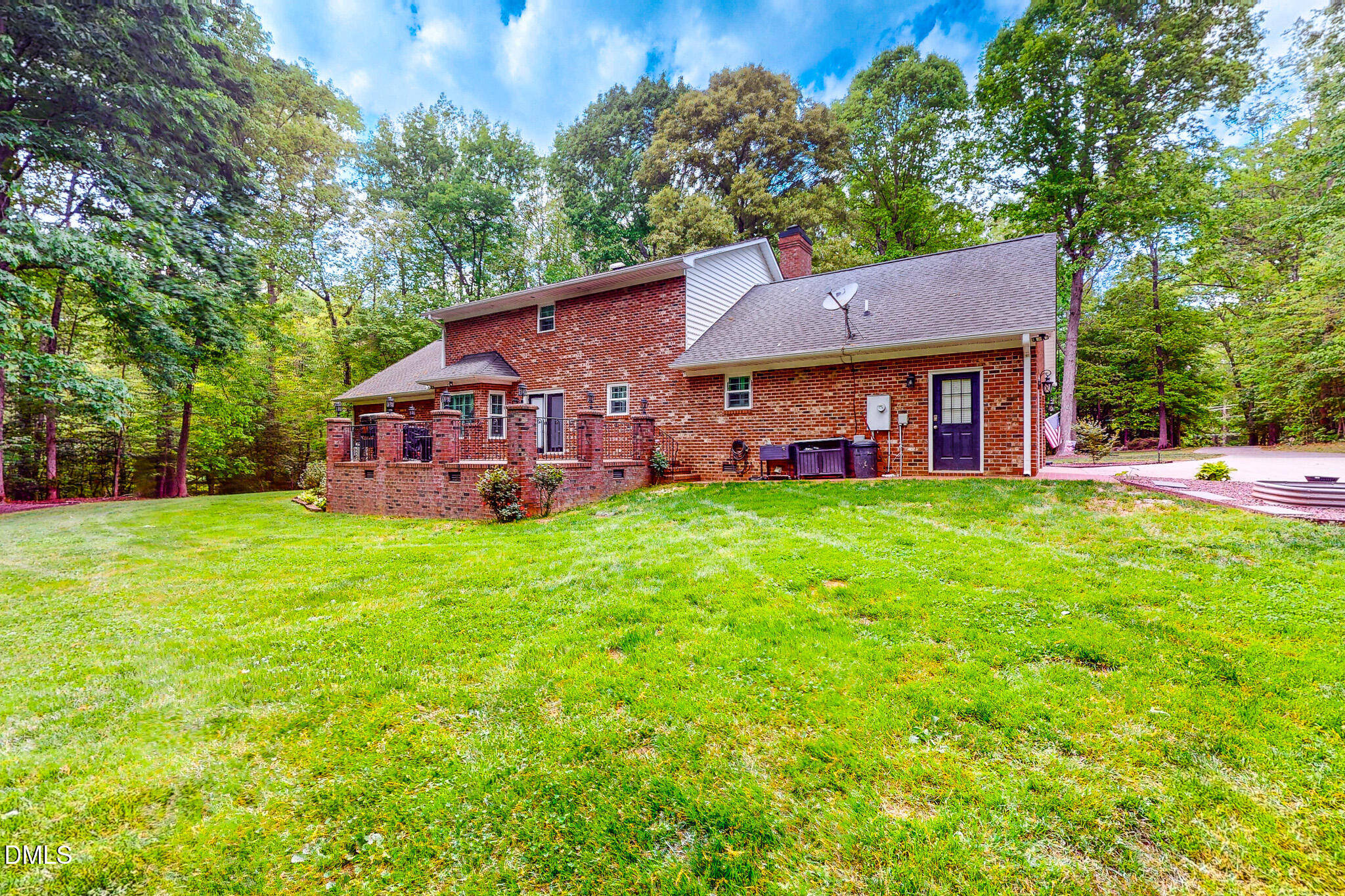 2428 Helena Moriah Road Timberlake, NC 27583 - Photo 32 of 73 a view of a house with a big yard potted plants and large tree