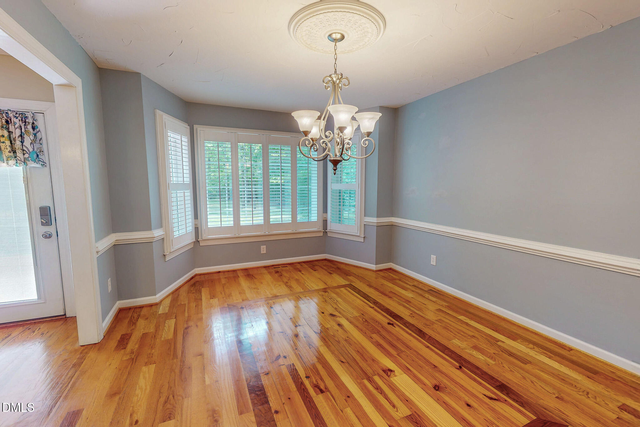 2428 Helena Moriah Road Timberlake, NC 27583 - Photo 46 of 73 a view of empty room with wooden floor and fan