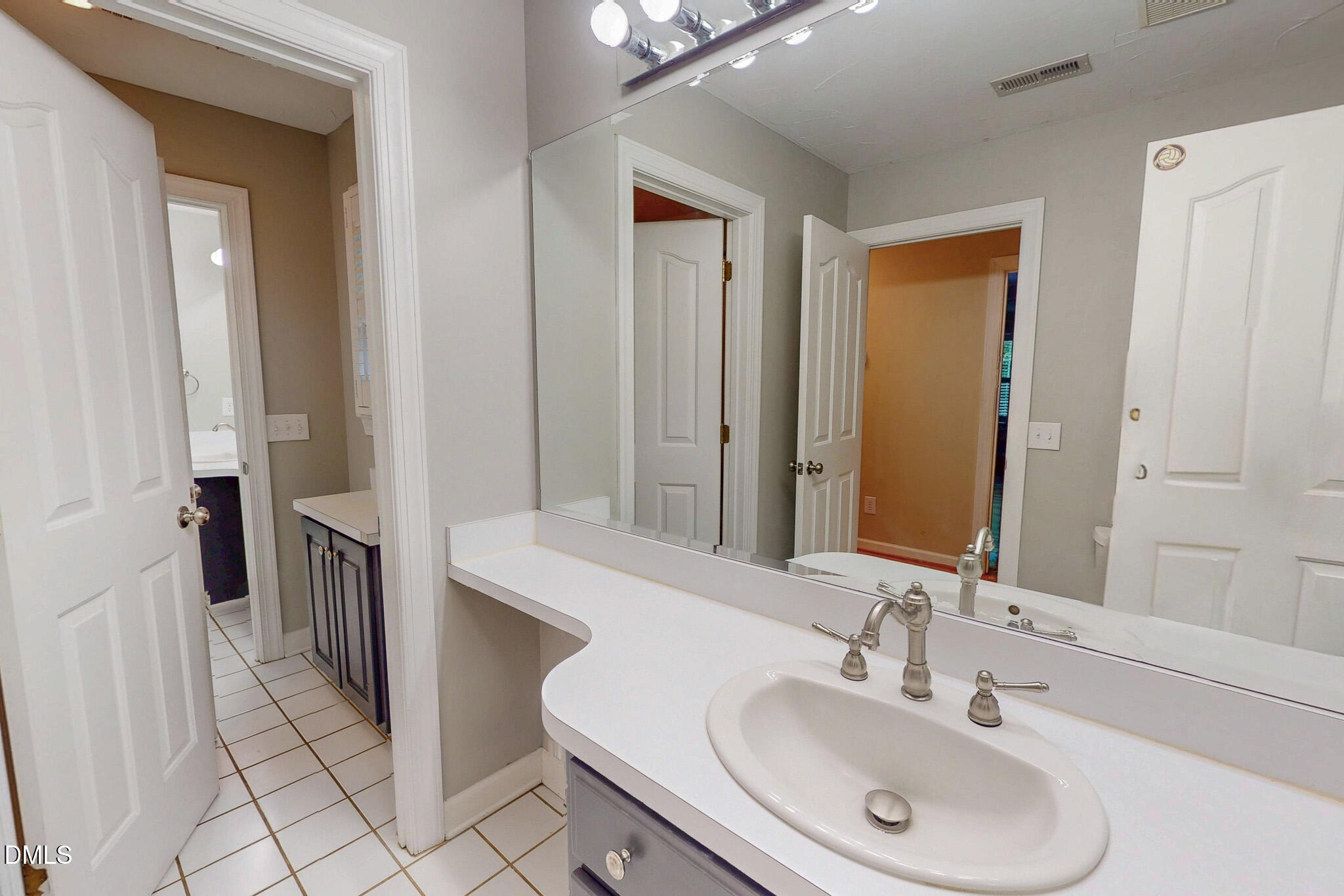 2428 Helena Moriah Road Timberlake, NC 27583 - Photo 56 of 73 a bathroom with a sink and a mirror
