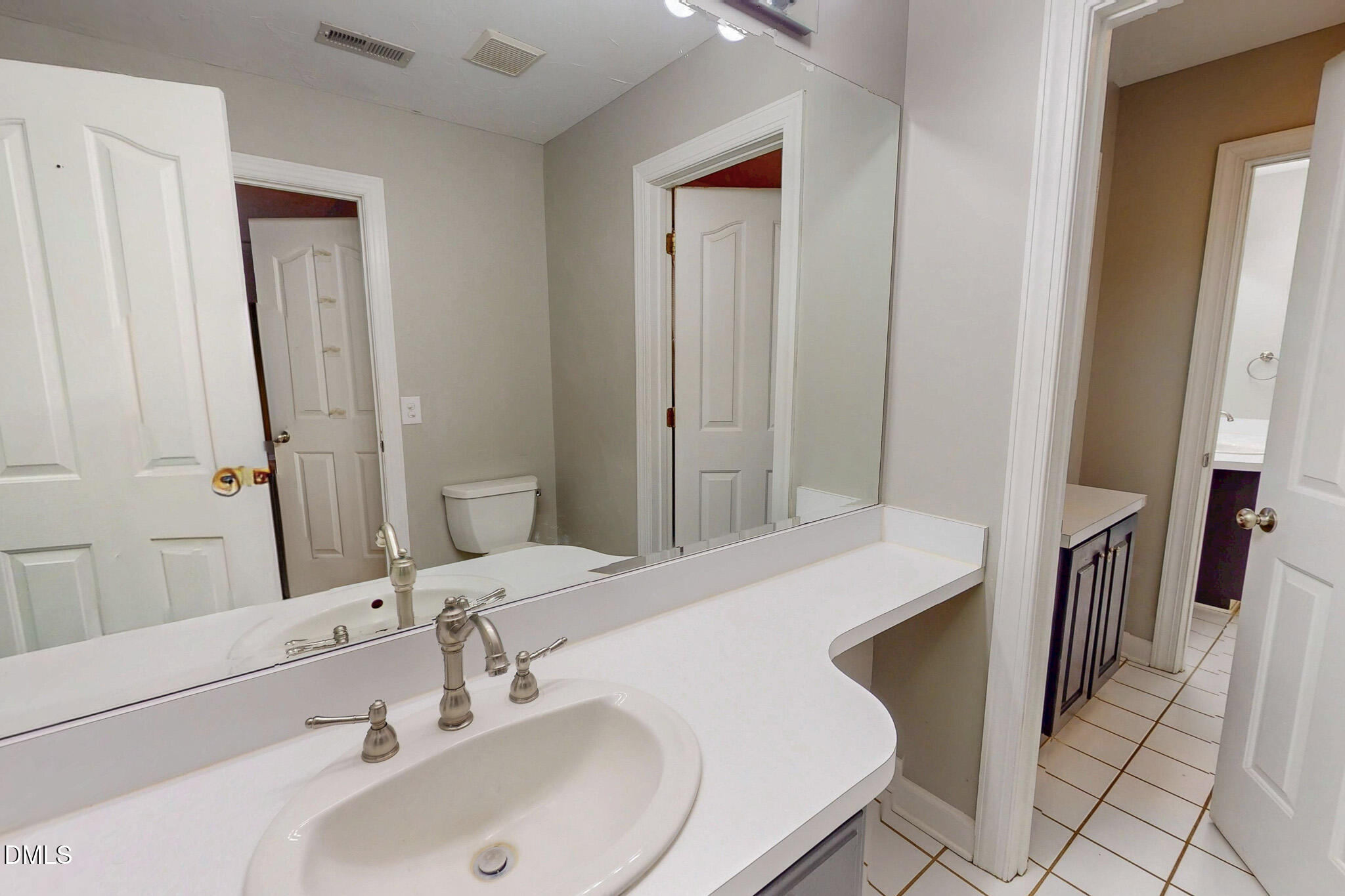 2428 Helena Moriah Road Timberlake, NC 27583 - Photo 62 of 73 a bathroom with a sink and a mirror