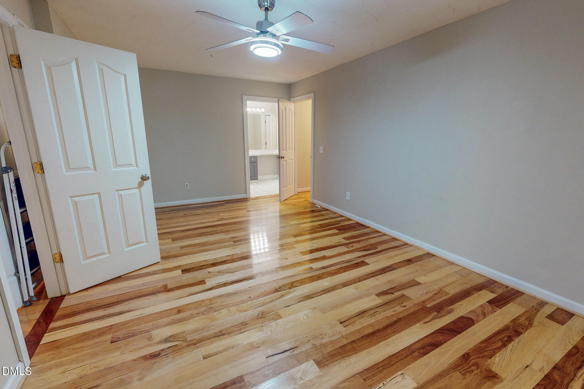 2428 Helena Moriah Road Timberlake, NC 27583 - Photo 63 of 73 a view of an empty room with wooden floor and fan