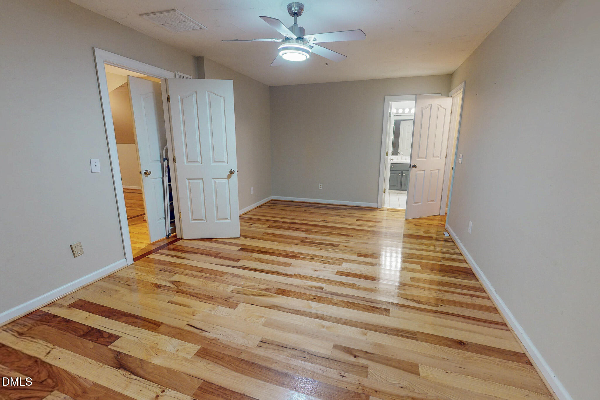 2428 Helena Moriah Road Timberlake, NC 27583 - Photo 64 of 73 a bedroom with a bed and a chandelier fan