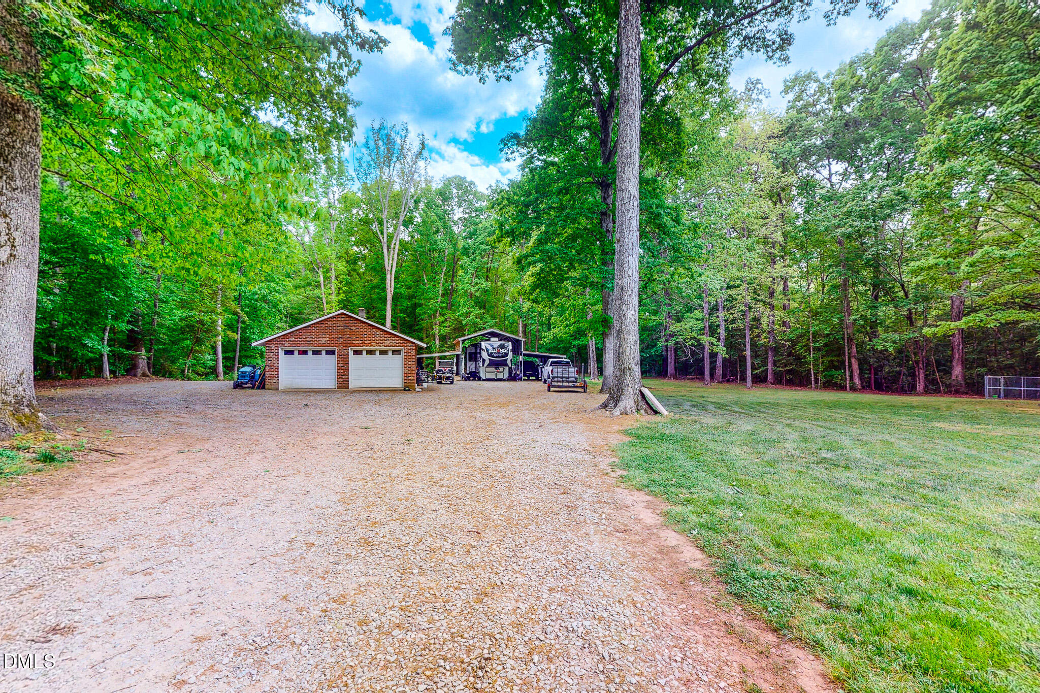 2428 Helena Moriah Road Timberlake, NC 27583 - Photo 7 of 73 a view of a house with a yard and large trees