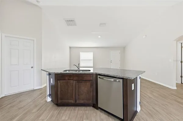 a kitchen with a sink and cabinets