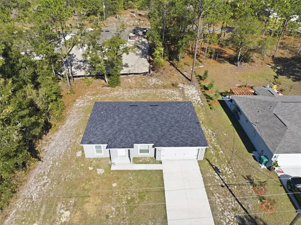 a view of a yard with swimming pool