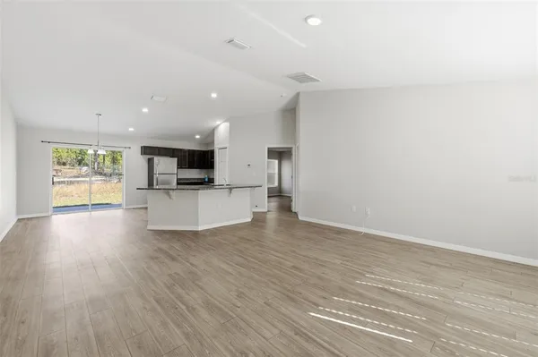 a view of a kitchen with a sink and a stove top oven