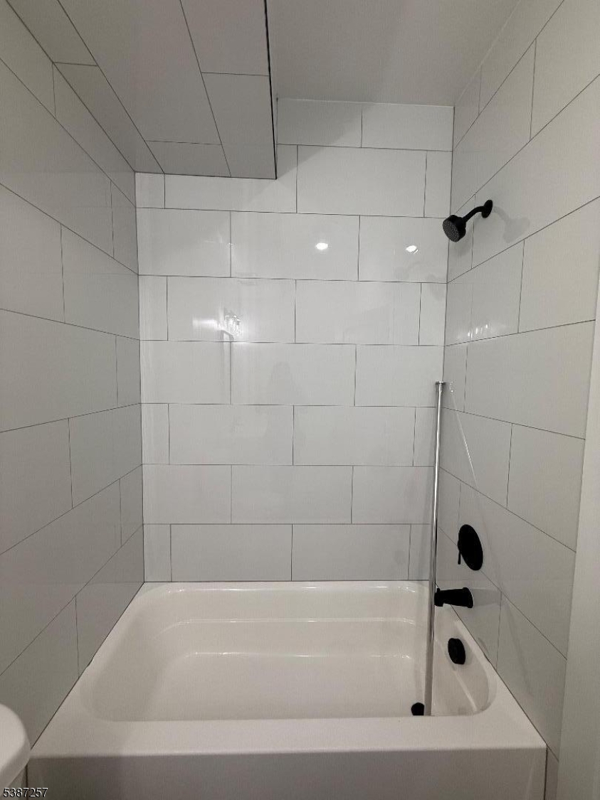 715 South 17th Street, Unit 2 Newark, NJ 07103 - Photo 16 of 24 a bathroom with a bathtub