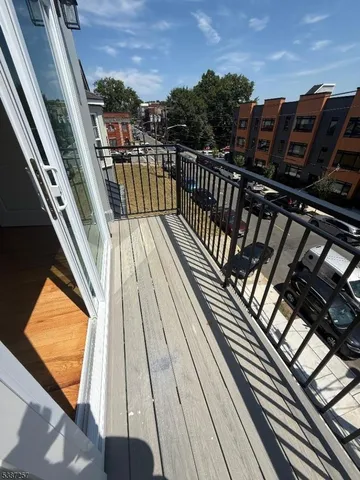 a view of balcony with wooden floor and outdoor space