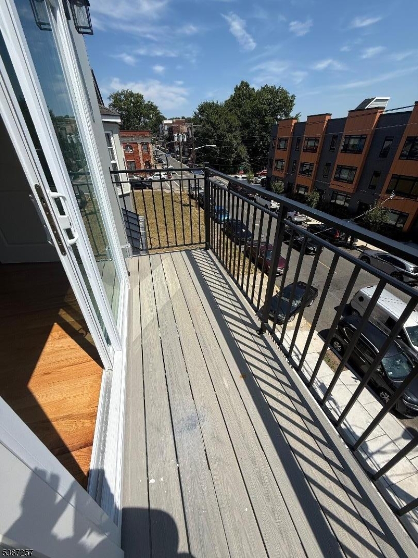 715 South 17th Street, Unit 2 Newark, NJ 07103 - Photo 19 of 24 a view of balcony with wooden floor and outdoor space