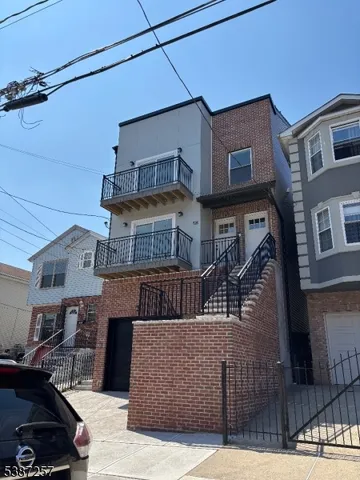 a front view of a house with glass windows