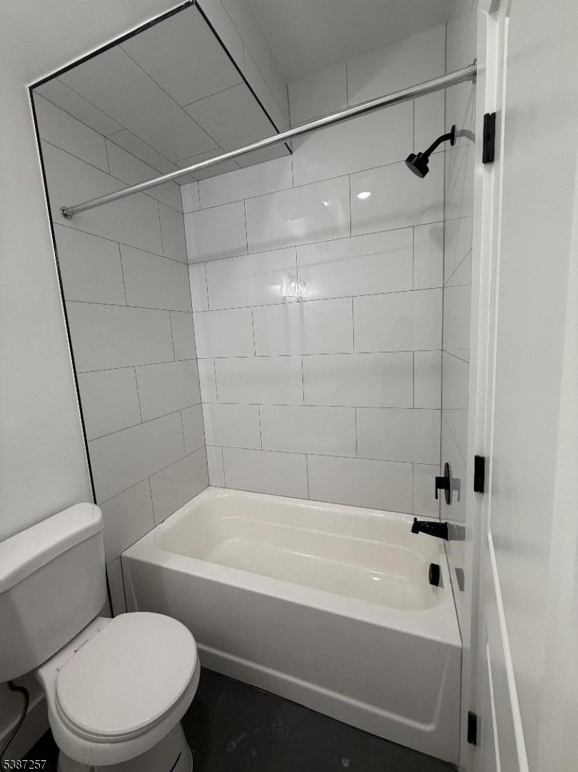 715 South 17th Street, Unit 2 Newark, NJ 07103 - Photo 9 of 24 a bathroom with a bathtub and a toilet