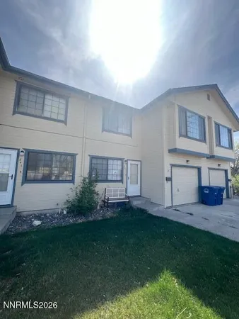 a view of house with backyard and garden