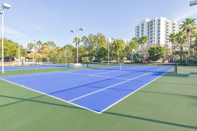 a view of a swimming pool with a patio and a garden