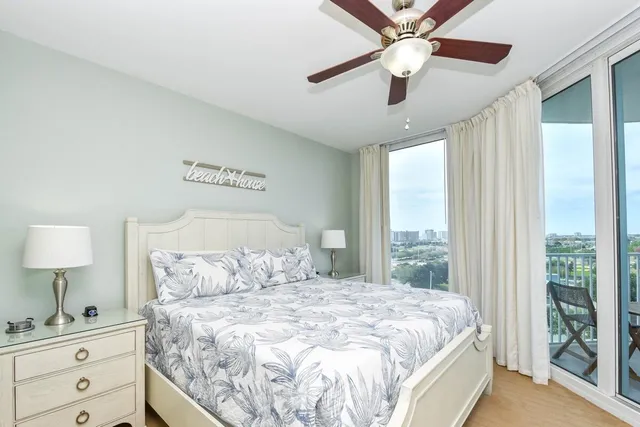 a bedroom with a large bed and a window